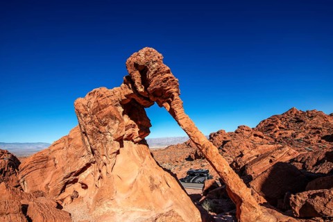 Motorhome driving below Elephant Rock, Valley of Fire State Park, Nevada, USA, North America