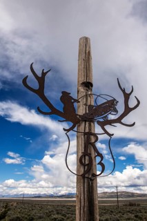 House number with fly fishing artwork, Highway 50, Loneliest Road in America, Ely, Nevada, USA,