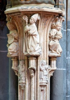 Stone figure of Cornelius in the choir, console with bishop and angels after the 2012 restoration,