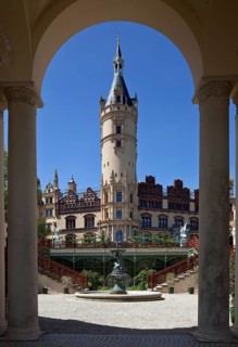 In front orangery around 1850 by F. A. Stüler, above it main tower, on the right large NEW HOUSE,