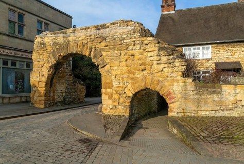 Newport Arch on Ermine Street, Roman entrance gateway to city of Lincoln, Lincolnshire, England, UK