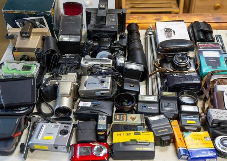 Display of old secondhand cameras and photographic equipment on display at auction, Campsea Ashe,