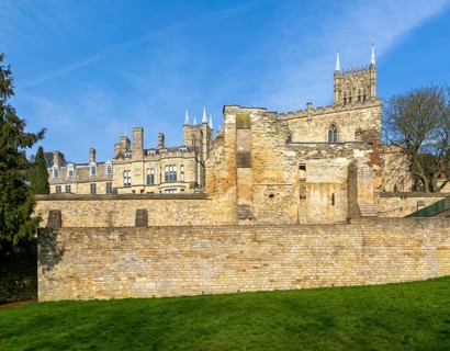 Walls of medieval Bishops' Palace from Temple Gardens park, city of Lincoln, Lincolnshire, England,