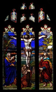Stained glass window of Jesus Christ Crucifixion Cross, church of Saint John the Baptist, Devizes,