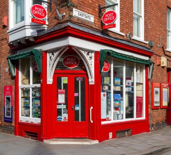 Post Office corner shop painted bright red, Eastgate, Bailgate, Uphill area of city of Lincoln,