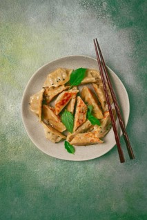 Japanese fried dumplings, gyoza, sesame seeds, top view, no people