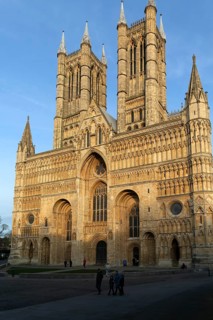 West frontage of cathedral church in evening light, Lincoln, Lincolnshire, England, UK