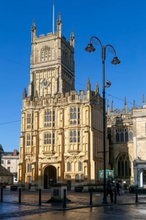 Tower and entrance doorway, Saint John the Baptist church, Cirencester, Gloucestershire, England,