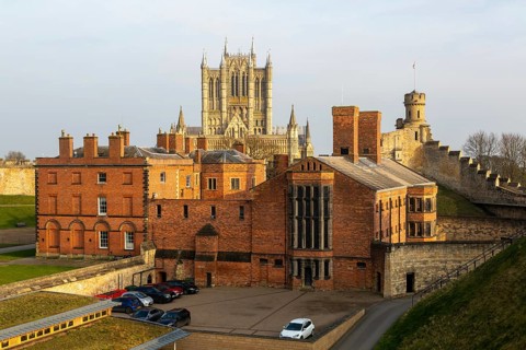 Cathedral and Victorian prison from medieval wall, inside Lincoln Castle, city of Lincoln,