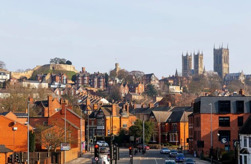 Castle and cathedral in Uphill area viewed from Brayford Way in city centre, Lincoln, Lincolnshire,