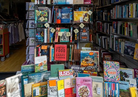 Shop window display of secondhand books in Dorothy House charity shop, Chippenham, Wiltshire,