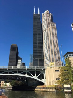 Skyscraper next to a bridge over a river in a modern urban environment, chicago, illinois, usa