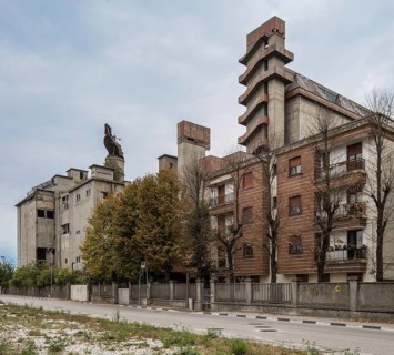 Porto Marghera near Venice, industrial harbour, malthouse and silo, residential building in front