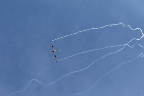 Airshow, glider with contrails against blue sky, Montreal, Province of Quebec, Canada, North