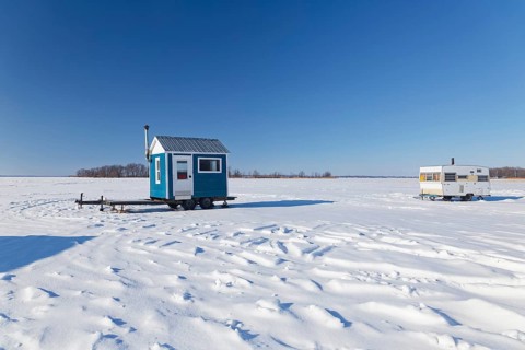 Winter, ice fishing hut on the Saint Lawrence River, Province of Quebec, Canada, North America