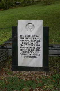 Probstzella, HAUS DES VOLKES, modern memorial stone in the park with marble relief of the founder