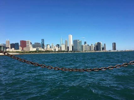 View across the sea to the coastline with a chain in the foreground, chicago, illinois, usa