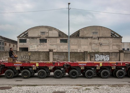 Porto Marghera near Venice, industrial harbour, warehouse with low loader