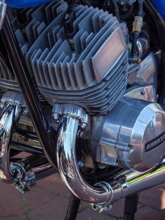 Close-up of a Kawasaki motorbike engine with blue and chrome-plated components, Appelhülsen,