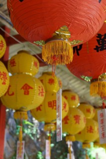 Close-up of red and yellow lanterns with Asian characters creating a festive atmosphere, penang,