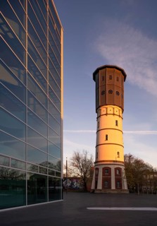 Gütersloh, historic water tower, on the left the façade of the theatre, built 2008-2010 by Jörg
