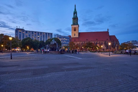 St. Mary's Church with Neptune Fountain and lanterns at dusk, Berlin, capital city, independent
