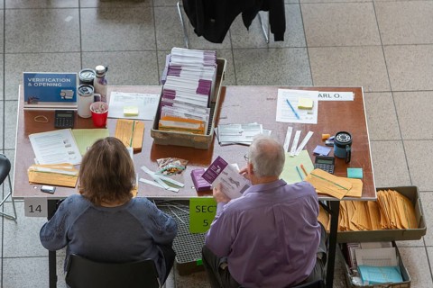Warren, Michigan USA, 5 November 2024, Election workers open and verify absentee ballots on