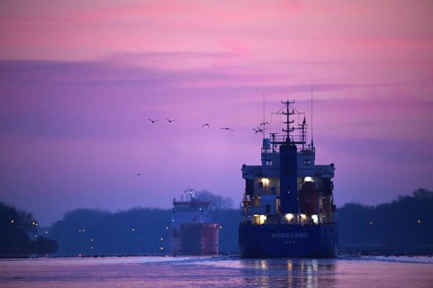 Ships, tanker, cargo ship meet at sunrise in the Kiel Canal, NOK, Kiel Canal, Schleswig-Holstein,