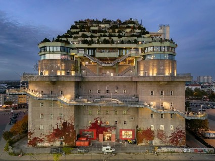 Hamburg Bunker with green roof, external stairs and stylish lights in an urban setting at blue