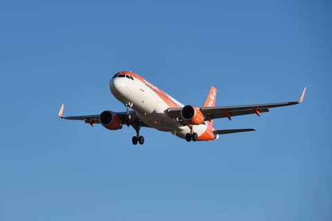 Lisbon, Portugal - September 2, 2023: easyJet Airbus A320-214 passenger plane descends to land in
