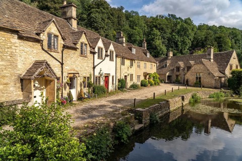 The village of Castle Combe on the River Bybrook, Cotswolds, Wiltshire, England, Great Britain