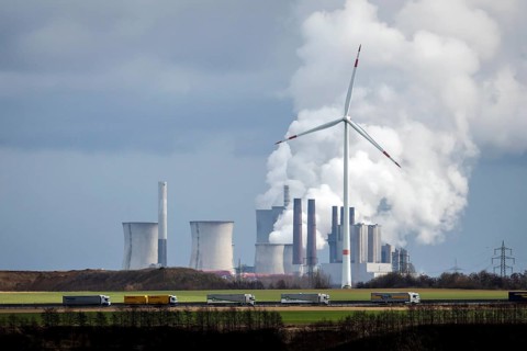 Grevenbroich, North Rhine-Westphalia, Germany - Lorry on A44 motorway and wind farm in front of RWE