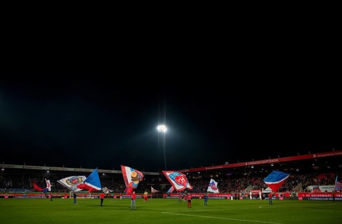 Night shot, flag waving, flags, flags in front of the start of a Bundesliga match, Voith-Arena,