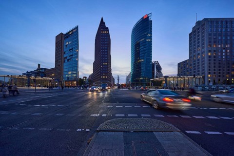 High-rise buildings Forum Tower, Kollhoff-Tower and Bahntower with car traffic in the blue hour at