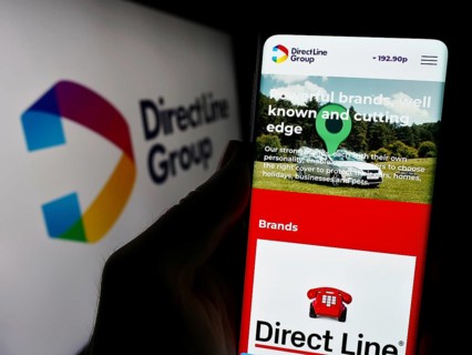 Stuttgart, Germany, 12-08-2023: Person holding smartphone with webpage of British financial company