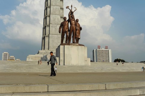 08.08.2012, Pyongyang, North Korea, Asia, A man passes in front of the Juche Monument on the banks
