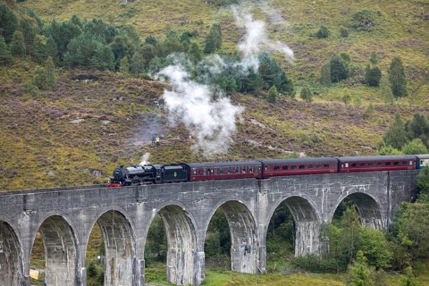 The Jacobite Steam Train, steam railway on the Glenfinnan railway viaduct, known from Harry Potter,