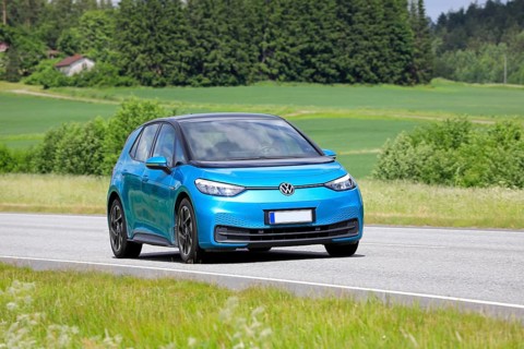 Blue Volkswagen VW ID.3 electric car driving on road on a sunny day of summer. Salo, Finland. June
