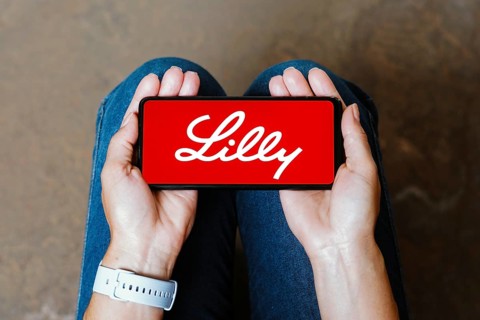 In this photo illustration, the Eli Lilly logo is displayed on a smartphone screen
