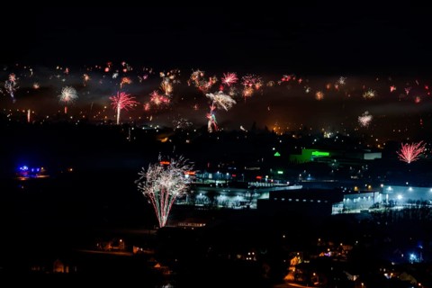 Large firework explosions light up the evening scenery of the city, Straubing, Lower Bavaria