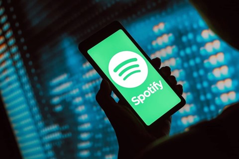 In this photo illustration, the Spotify Technology logo is displayed on a smartphone screen