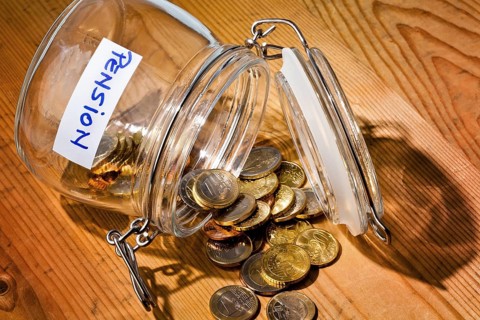 Pieces of money in a jam jar. Provision for old age is becoming less and less. Poverty in