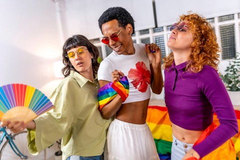 Lgbt multi-ethnic and gender students partying at home celebrating pride