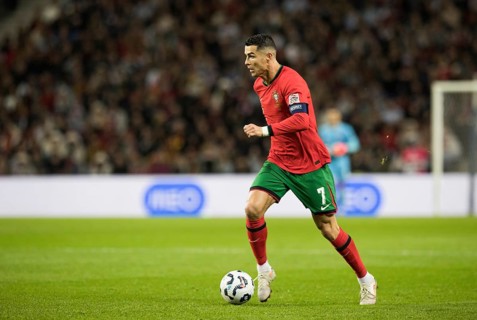 Football match, captain Cristiano RONALDO CR7 Portugal on the ball running towards the left looking
