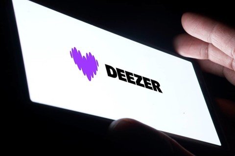 deezer logo is displayed on smartphone. Deezer is a French music streaming service