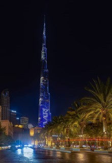 A picture of the iconic Burj Khalifa with its light show at night