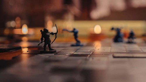 Dungeons and Dragons board game in the evening time. Archer