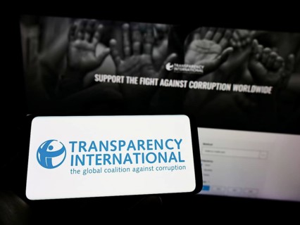 Stuttgart, Germany, 10-02-2022: Person holding cellphone with logo of association Transparency