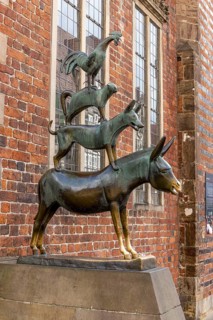 The famous bronze statue of the Bremen Town Musicians with the figures of a donkey, dog, cat and