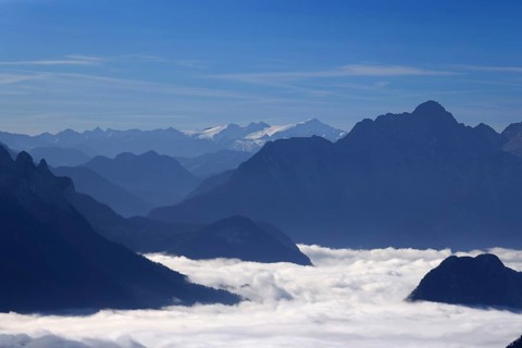 Mountains rising from a closed fog cover, view from Hochstaufen to Großvenediger, morning sun,